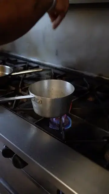 Seasoning a pan in the Breaking the Fast kitchen